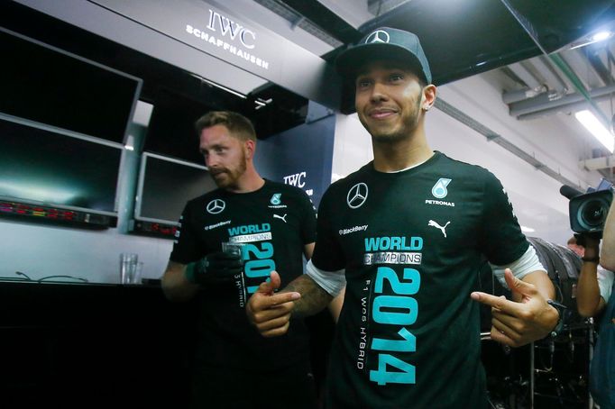 Mercedes Formula One driver Lewis Hamilton of Britain gestures after the first Russian Grand Prix in Sochi October 12, 2014. REUTERS/Maxim Shemetov (RUSSIA - Tags: SPORT