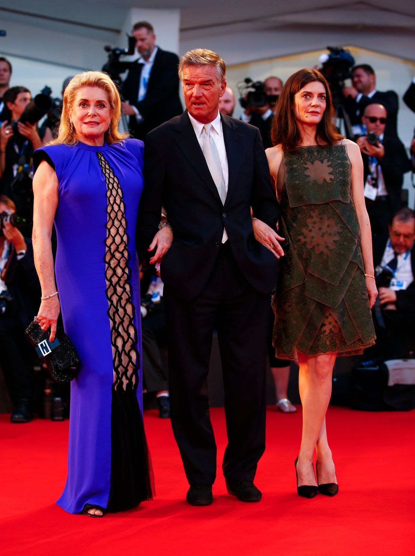Director Jacquot poses with actresses Deneuve, and Mastroianni during the red carpet for the movie &quot;3 Coeurs&quot; (3 Hearts) at the 71st Venice Film Festival