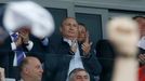 Russia's President Vladimir Putin (top) applauds during the men's ice hockey World Championship final game between Finland and Russia at Minsk Arena in Minsk May 25, 2014