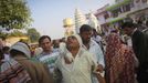 Relatives of a devotee who is believed to be possessed by evil spirits hold him as he walks in a state of trance around the courtyard of Guru Deoji Maharaj temple during a ghost fair at Malajpur village in Betul district in the central Indian state of Madhya Pradesh January 26, 2013. People from across India come to this fair to be exorcised of �evil spirits�. They are usually brought by relatives and they are most often women. The exorcism involves running around the temple courtyard to make the 'ghost' weak then being beaten by a priest with a broom. Picture taken January 26, 2013. REUTERS/Danish Siddiqui (INDIA - Tags: SOCIETY RELIGION) ATTENTION EDITORS: PICTURE 3 OF 24 FOR PACKAGE 'INDIAN GHOSTBUSTERS' SEARCH 'INDIA GHOST' FOR ALL IMAGES Published: Úno. 5, 2013, 5:09 dop.