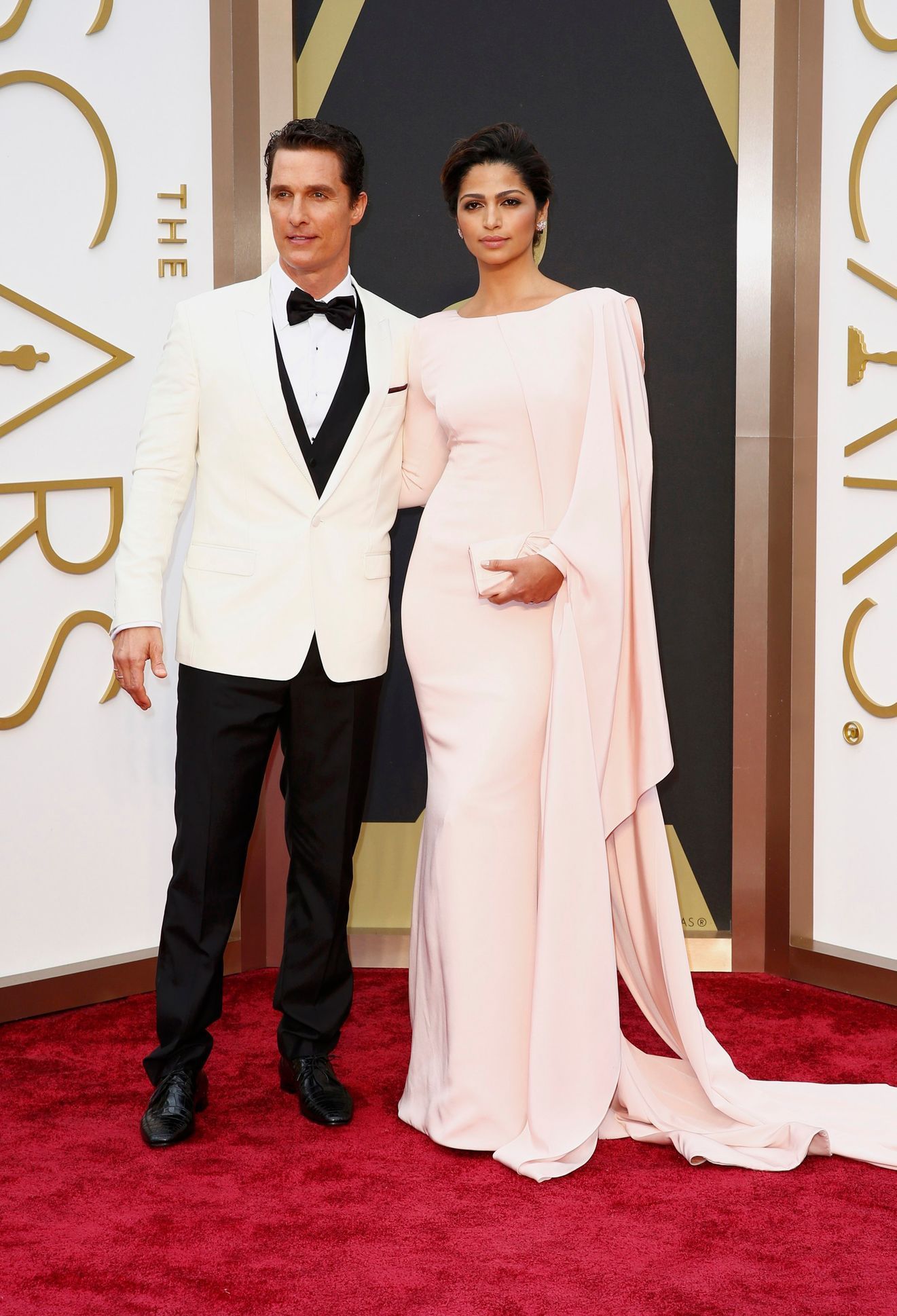 Actor McConaughey and his wife Camila arrive at the 86th Academy Awards in Hollywood