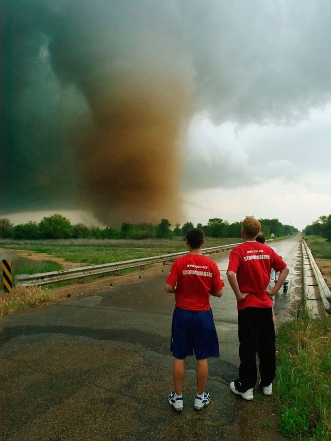 Storm Chasers Watch a Large Tornado Original caption:Storm chasers keep a close eye on a large tornado near Attica, Kansas on May 12, 2004.