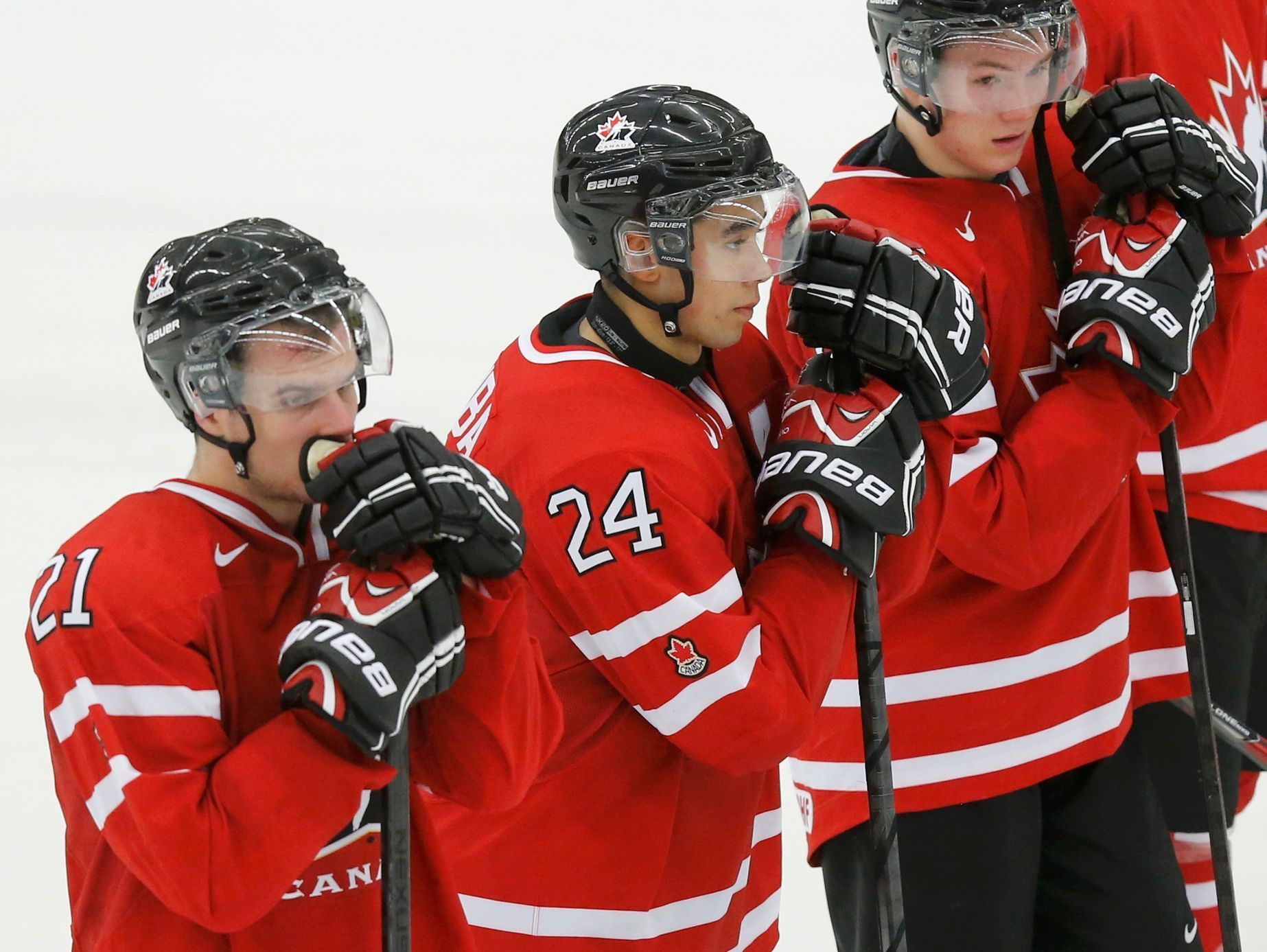 Canada's Laughton, Dumba and Lazar react after their loss to the Czech Republic in their IIHF World Junior Championship ice hockey game in Malmo