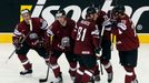 Latvia's Kristaps Sotnieks (2nd L) celebrates his foal against Finland with team mates during the third period of their men's ice hockey World Championship group B game a