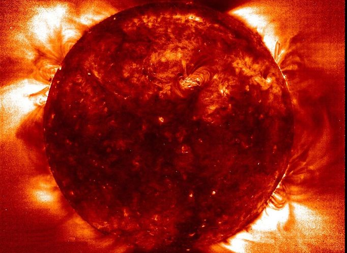 This picture indicates temperature distribution in the sun's corona, with dark areas representing cooler regions and bright areas being hotter. Credit: NASA