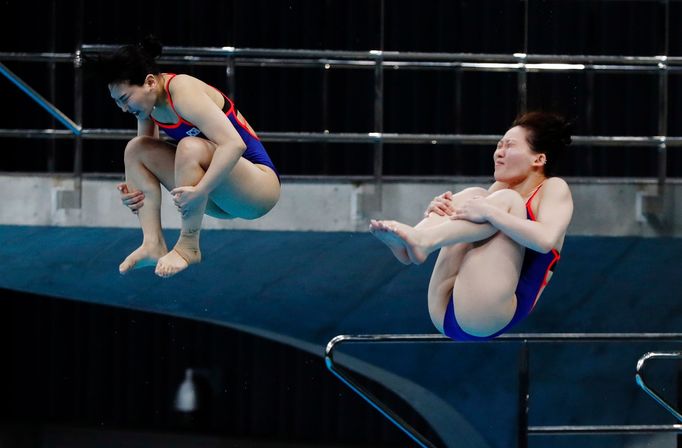 Diving - FINA Diving World Cup 2021 and Tokyo 2020 Olympics Aquatics Test Event - Tokyo Aquatics Centre, Tokyo, Japan - May 1, 2021 South Korea's Kim Suji and Cho Eunbi i