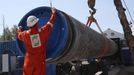 A worker puts a cap to a pipe at the construction site of the Nord Stream 2 gas pipeline, near the town of Kingisepp, Leningrad region, Russia June 5, 2019. REUTERS/Anton