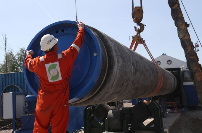 A worker puts a cap to a pipe at the construction site of the Nord Stream 2 gas pipeline, near the town of Kingisepp, Leningrad region, Russia June 5, 2019. REUTERS/Anton