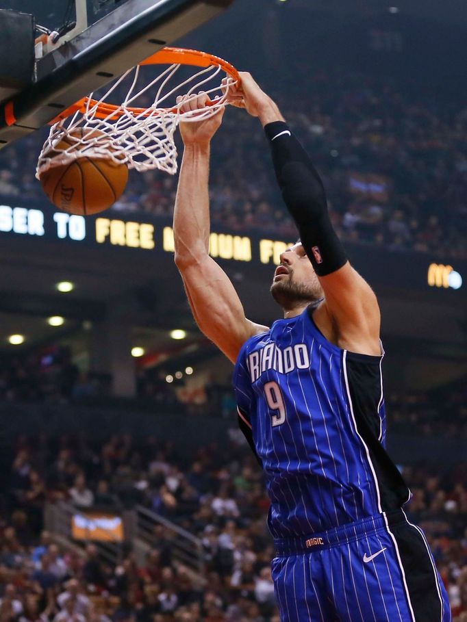 Feb 24, 2019; Toronto, Ontario, CAN; Orlando Magic center Nikola Vucevic (9) dunks the ball against the Toronto Raptors during the first quarter at Scotiabank Arena. Mand