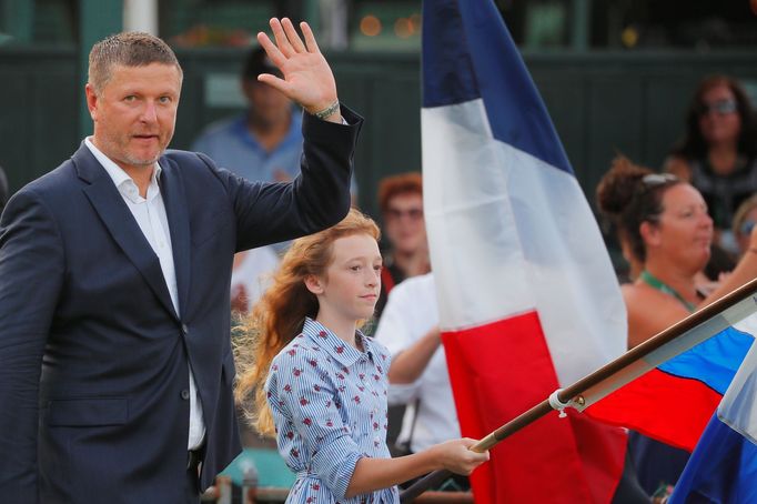 Jevgenij Kafelnikov of Russia takes the stage to be inducted into the International Tennis Hall of Fame in Newport, Rhode Island, U.S., July 20, 2019. REUTERS/B