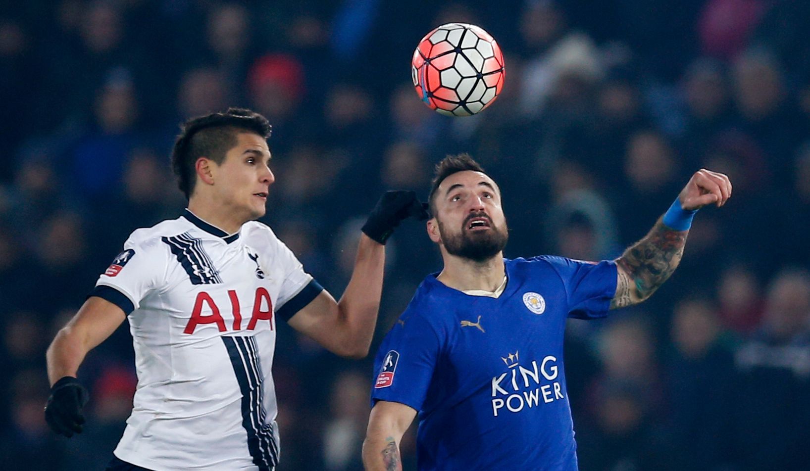 Tottenham's Erik Lamela in action with Leicester City's Marcin Wasilewski