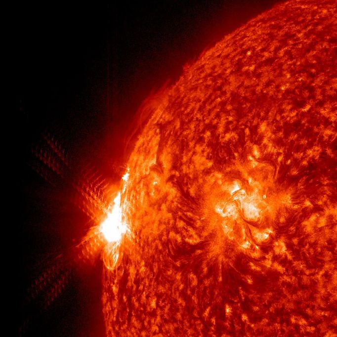 Big, Bright Flare Just as an active region rotated into view, it unleashed a large (X1.4 class) solar flare (Sept. 22, 2011) as well as several smaller flares and a significant coronal mass ejection. Predictions are that the storm will likely not impact Earth. Following the bright flare, one can see brilliant coils of magnetic field lines regrouping themselves. Images were taken by NASA's Solar Dynamics Observatory in extreme ultraviolet light.