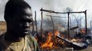 A SPLA soldier walks in a market destroyed in an air strike by the Sudanese air force in Rubkona near Bentiu