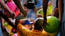 Canada's Eugenie Bouchard is mobbed for autographs after defeating Olga Govortsova of Belarus during their match at the 2014 U.S. Open tennis tournament in New York