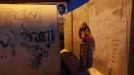 An Israeli girl stands outside a sewage pipe used as shelter after an air raid siren warning of incoming rockets in the southern community of Nitzan, near Ashdod November 15, 2012. A Hamas rocket killed three Israelis north of the Gaza Strip on Thursday, drawing the first blood from Israel as the Palestinian death toll rose to 15 in a military showdown lurching closer to all-out war and an invasion of the enclave. REUTERS/ Nir Elias (ISRAEL - Tags: POLITICS CIVIL UNREST TPX IMAGES OF THE DAY) Published: Lis. 15, 2012, 4:57 odp.