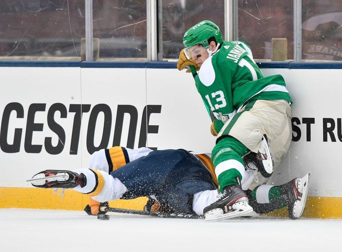 Jan 1, 2020; Dallas, TX, USA; Dallas Stars center Mattias Janmark (13) battles for the puck with Nashville Predators defenseman Dante Fabbro (57) during the first period