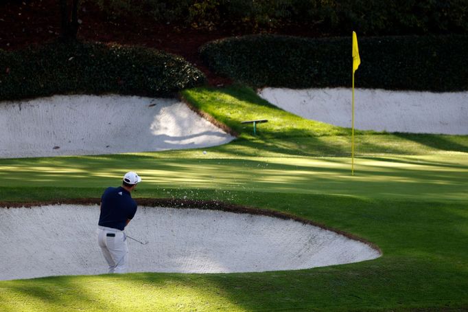 Golf - The Masters - Augusta National Golf Club - Augusta, Georgia, U.S. - November 12, 2020 Spain's Jon Rahm plays out of a bunker on the 12th during the first round REU