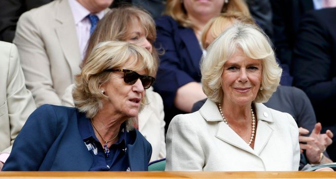 Britain's Camilla, Duchess of Cornwall (R) sits on Centre Court at the Wimbledon Tennis Championships, in London June 27, 2013. REUTERS/Suzanne Plunkett (BRITAIN - Tags: