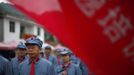 Mid-level government officials dressed in red army uniforms walk into an old house where former Chinese leader Mao Zedong used to live during their 5 days training course at the communist party school called China Executive Leadership Academy of Jinggangshan, in Jiangxi province, in this September 21, 2012 file photo. China's Communist Party has dramatically stepped up its training of the country's roughly 40 million party and government officials in the past decade. With public scrutiny of cadre behaviour growing via social media, the party is likely to call for continued, and deepened, cadre education at the upcoming 18th Party Congress. At the vanguard of this education drive, alongside a Central Party School in Beijing, are three "Executive Leadership Academies" which opened in 2005 for middle-ranking and senior officials in Shanghai, Yan'an and Jinggangshan. The curriculum covers Marxism, Leninism and Mao Zedong Thought, but students may also take finance courses, receive in-depth media training or role-play crisis management scenarios on everything from disease outbreaks to train wrecks. REUTERS/Carlos Barria/Files (CHINA - Tags: POLITICS SOCIETY) Published: Zář. 24, 2012, 2:43 odp.