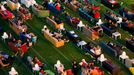 People sit on sofas as they watch the opening game of the 2014 World Cup between Brazil and Croatia, during a public viewing event at the Alte Foersterei stadium in Berli