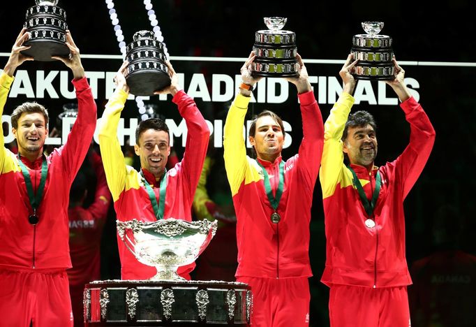 Tennis - Davis Cup Finals - Final - Caja Magica, Madrid, Spain - November 24, 2019   Spain's Rafael Nadal and captain Sergi Bruguera lift their trophies with team mates a