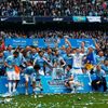 Manchester City's team celebrate after winning the English Premier League following their soccer match against West Ham United at the Etihad Stadium in Manchester