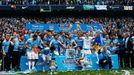 Manchester City's team celebrate after winning the English Premier League following their soccer match against West Ham United at the Etihad Stadium in Manchester