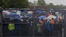 People arrive at First National Bank (FNB) Stadium, also known as Soccer City, ahead of a mass memorial for late former South African President Nelson Mandela in Johannesburg December 10, 2013.