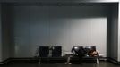 A passenger sleeps at the terminal of German air carrier Lufthansa at the Fraport airport in Frankfurt, September 7, 2012. German air carrier Lufthansa passengers face widespread flight disruption after cabin crew representatives said they continue a series of strikes over pay and cost-cutting measures at Germany's largest airline. The UFO union, which represents around two-thirds of Lufthansa's 19,000 cabin crew called on its members to strike for 24 hours on all German airports on Friday. REUTERS/Kai Pfaffenbach (GERMANY - Tags: BUSINESS EMPLOYMENT CIVIL UNREST TRANSPORT) Published: Zář. 7, 2012, 6:18 dop.