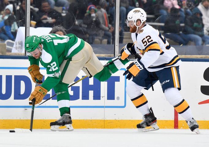 Jan 1, 2020; Dallas, TX, USA; Dallas Stars center Radek Faksa (12) chases the puck with Nashville Predators defenseman Matt Irwin (52) during the second period in the 202