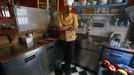 Manolis Ouranos, a 30 year-old cook, poses for a picture in the Mavros Gatos (Black Cat) tavern in Psiri neighboorhood in central Athens May 23, 2012. Manolis studied at Athens Technology University (TEI) for four years where he received a degree in civil engineering. He hoped to find a permanent job in public sector infrastructure but has been working as a cook for four months instead. He now takes cooking lessons which he funds with his salary as a cook.