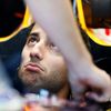 Red Bull Formula One driver Daniel Ricciardo of Australia looks up from his car in the team garage during the first practice session of the Australian F1 Grand Prix at the Albert Park circuit in Melbo