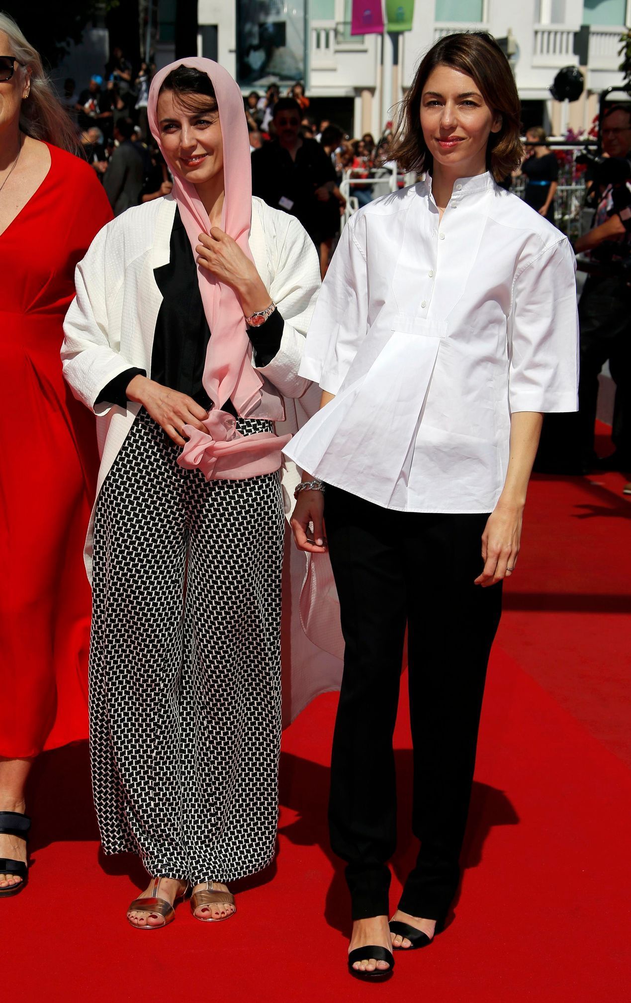 Jury member actress Leila Hatami and director Sofia Coppola  pose on the red carpet as they arrive for the screening of the film &quot;Futatsume no mado&quot; in competition at the 67th Cannes Film Fe