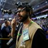 A member of the media wears a head-mounted camera to record events ahead of the start of the NFL Super Bowl XLIX football game between the Seattle Seahawks and the New England Patriots in Glendale