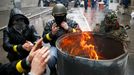 Pro-Russian men gather around a fire at a barricade near the police headquarters in Slaviansk April 13, 2014.