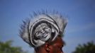 RNPS IMAGES OF THE YEAR 2012 - A man, who identified himself as Mohawk Gaz, sports an image of black teenager Trayvon Martin on his hair during a rally to protest his killing in Miami, Florida April 1, 2012. Thousands of protesters gathered in a downtown bayfront park on Sunday demanding the arrest of the neighborhood watch volunteer who shot and killed an unarmed black teenager, Trayvon Martin, in central Florida a month ago. REUTERS/Lucas Jackson (UNITED STATES - Tags: CRIME LAW CIVIL UNREST TPX IMAGES OF THE DAY) Published: Pro. 5, 2012, 10:57 odp.