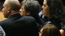 L-R: Aaron Poland, Mary Janice Poland and Lydia Hancock, son, wife and daughter of murdered bus driver Charles Albert Poland Jr., listen to a speaker at the funeral for Poland Jr. at Ozark Civic Center, near Midland City, Alabama, February 3, 2013. Mourners in the small town of Midland City, Alabama, gathered on Sunday to bury a school bus driver slain during the abduction of a child taken captive and held for a sixth day by a gunman in an underground bunker. REUTERS/Phil Sears (UNITED STATES - Tags: CRIME OBITUARY) Published: Úno. 4, 2013, 12:41 dop.