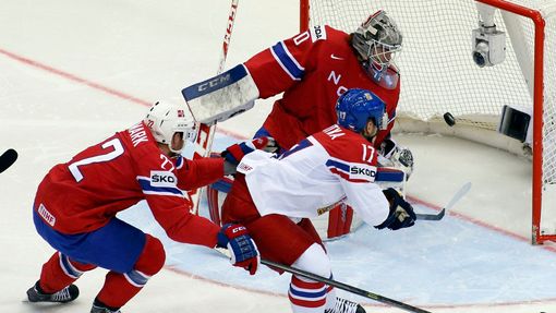 Vladimir Sobotka of the Czech Republic (C) scores past Norway's Martin Roymark (L) and goalie Steffen Soberg (R) during the first period of their men's ice hockey World C
