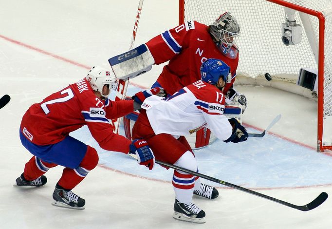 Vladimir Sobotka of the Czech Republic (C) scores past Norway's Martin Roymark (L) and goalie Steffen Soberg (R) during the first period of their men's ice hockey World C