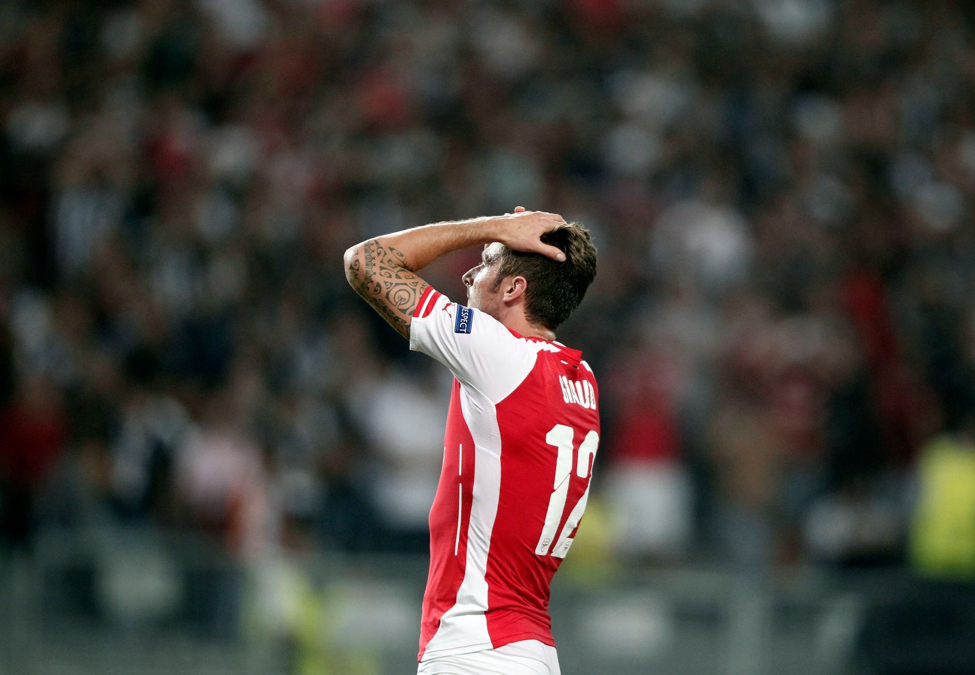 Arsenal's Grioud reacts during the first leg of their Champions League qualifying soccer match aganist Besiktas