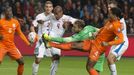 Goalkeeper Jeroen Zoet (C) of the Netherlands fights for the ball with Theodor Gebre Selassie of Czech Republic during their Euro 2016 group A qualifying soccer match in