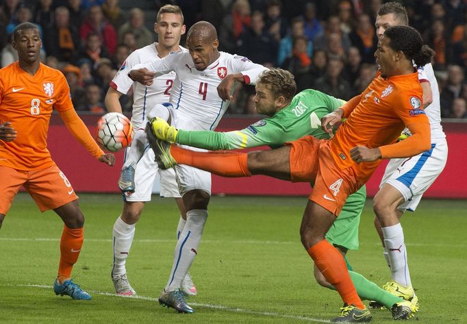 Goalkeeper Jeroen Zoet (C) of the Netherlands fights for the ball with Theodor Gebre Selassie of Czech Republic during their Euro 2016 group A qualifying soccer match in