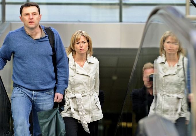 Kate and Gerry McCann, the parents of missing British girl Madeleine McCann, prepare to board the Eurostar at Saint Pancras Station in London April 9, 2008. The McCanns are due to speak at the European Parliament in Brussels on Thursday to help launch a new EU-wide helpline for missing children. REUTERS/Dylan Martinez (BRITAIN)