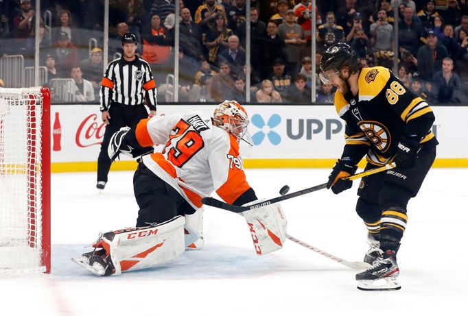 Nov 10, 2019; Boston, MA, USA; Boston Bruins right wing David Pastrňák (88) is stopped on the final shootout attempt by Philadelphia Flyers goaltender Carter Hart (79) du