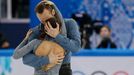 Daniel Wende and Maylin Wende of Germany embrace at the end of their performance during the Team Pairs Short Program at the Sochi 2014 Winter Olympics