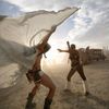 Dillon Bracken and Atalya Stachel dance during the Burning Man 2014 &quot;Caravansary&quot; arts and music festival in the Black Rock Desert of Nevada