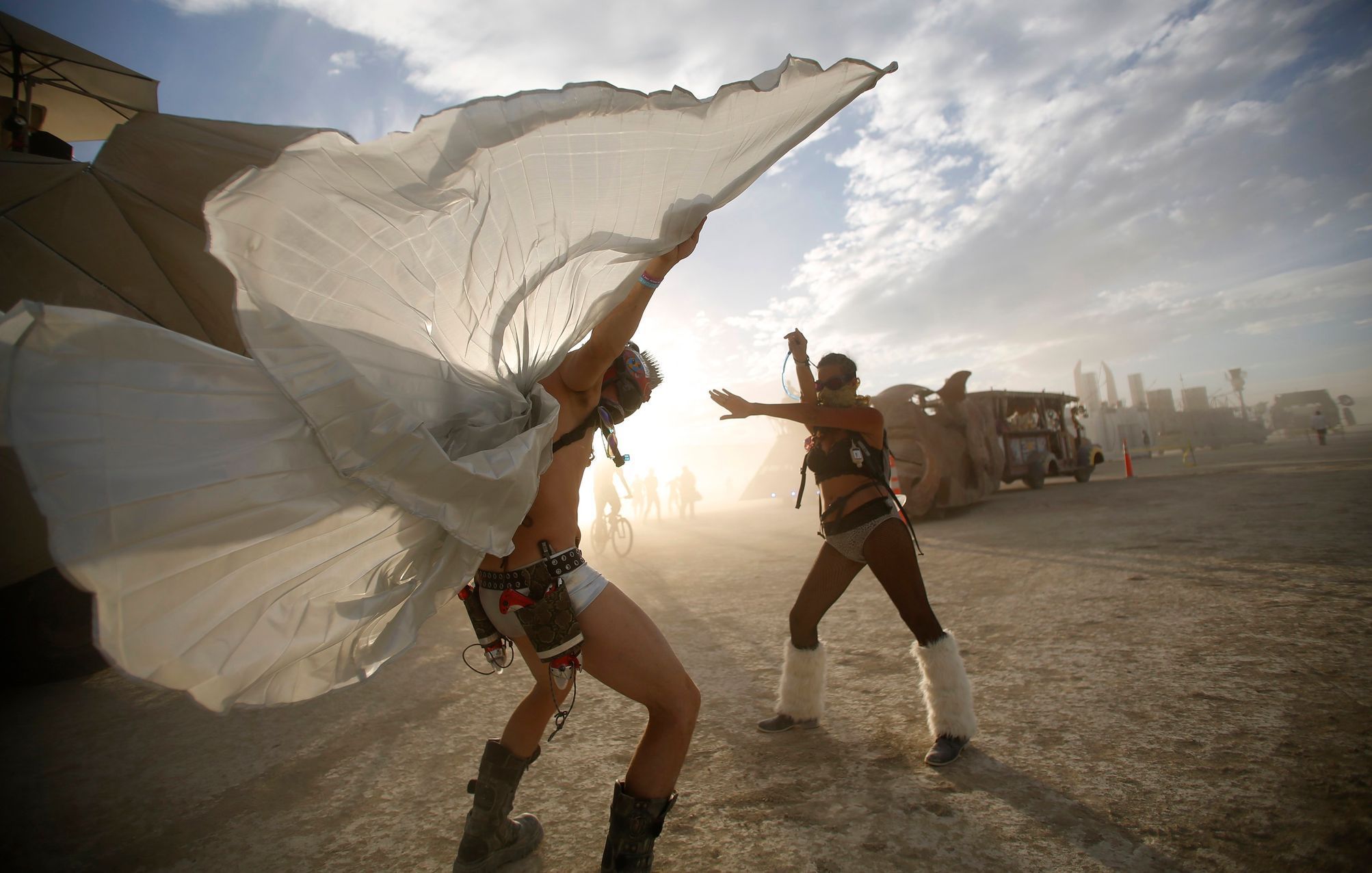 Dillon Bracken and Atalya Stachel dance during the Burning Man 2014 &quot;Caravansary&quot; arts and music festival in the Black Rock Desert of Nevada