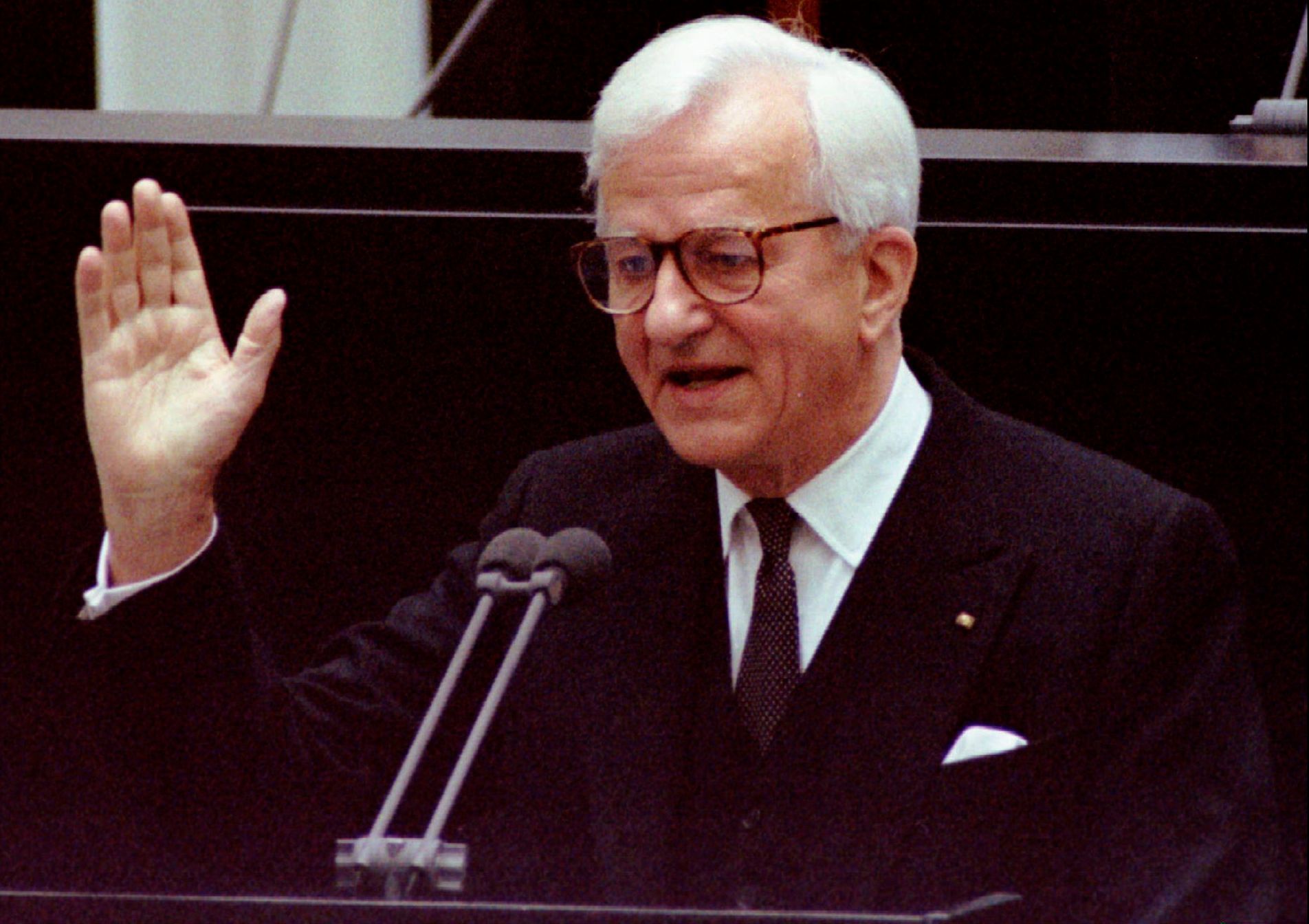 File photo of then outgoing German President Weizsaecker gesturing to ask the members of the lower and upper house of parliament to stopping their applause during his farewell speech in the Berlin Rei