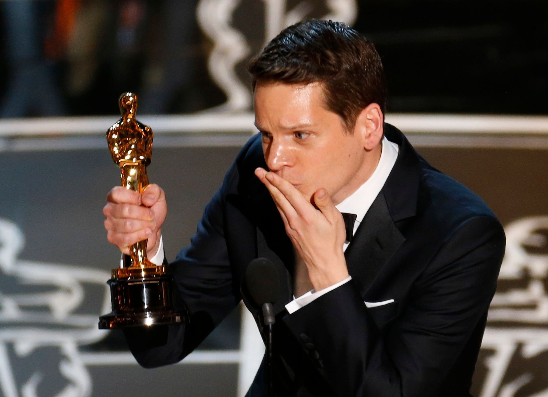 Writer Moore accepts the Oscar for best adapted screenplay for the film &quot;The Imitation Game&quot; during the 87th Academy Awards in Hollywood