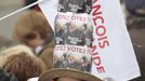 A supporter of Francois Hollande, Socialist Party candidate for the 2012 French presidential election, wears a home-made hat as she attends a campaign rally near the Chateau de Vincennes in Paris